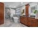 Elegant bathroom featuring a soaking tub, a modern vanity, and contemporary design at 7729 Lake Andrea Cir, Mount Dora, FL 32757