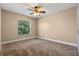 Bright bedroom with ceiling fan and spacious layout, providing a blank canvas for personalization and comfort at 7729 Lake Andrea Cir, Mount Dora, FL 32757
