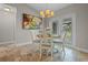Charming dining area with access to the outdoors, offering a serene and picturesque setting for meals at 7729 Lake Andrea Cir, Mount Dora, FL 32757