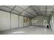 Large garage with concrete floor at 7729 Lake Andrea Cir, Mount Dora, FL 32757