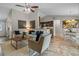 Open-concept living space with views of the kitchen and dining area, featuring tile floors and modern decor at 7729 Lake Andrea Cir, Mount Dora, FL 32757