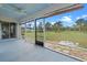 Screened-in porch with views of the backyard at 7729 Lake Andrea Cir, Mount Dora, FL 32757
