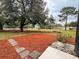 Inviting backyard showcasing landscaping and stone pavers at 9113 Sw 91St Court Rd, Ocala, FL 34481