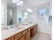 Bathroom with double sink vanity and large mirror at 9113 Sw 91St Court Rd, Ocala, FL 34481