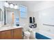 Bright bathroom features a shower/tub combo with decorative items and a marble sink at 9113 Sw 91St Court Rd, Ocala, FL 34481