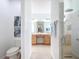 Bright bathroom featuring a double vanity, tile flooring, and a glass-enclosed shower at 9113 Sw 91St Court Rd, Ocala, FL 34481