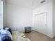 Simple bedroom with a daybed under the window, gray nightstand and closet at 9113 Sw 91St Court Rd, Ocala, FL 34481