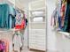 Walk-in closet with multiple shelves and clothing racks at 9113 Sw 91St Court Rd, Ocala, FL 34481