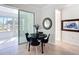 Cozy dining area with modern black table and access to sunroom at 9113 Sw 91St Court Rd, Ocala, FL 34481