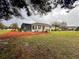 Lush backyard featuring a screened lanai and mature landscaping at 9113 Sw 91St Court Rd, Ocala, FL 34481