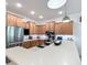 Spacious kitchen with stainless steel appliances, wooden cabinets, and a large center island at 9113 Sw 91St Court Rd, Ocala, FL 34481