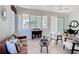 Bright living room features neutral walls, tile floor, and modern furnishings at 9113 Sw 91St Court Rd, Ocala, FL 34481