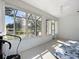 Cozy sunroom with lots of windows providing natural light and a view to the outdoor at 9113 Sw 91St Court Rd, Ocala, FL 34481