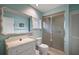 Bathroom featuring a toilet, shower, mirror, vanity, and decorative touches at 100 S Tremain St # G1, Mount Dora, FL 32757