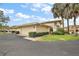 Inviting home exterior featuring a well-manicured lawn and a private two-car garage at 100 S Tremain St # G1, Mount Dora, FL 32757