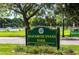 Elizabeth Evans Park sign with well-manicured landscaping and green space at 100 S Tremain St # G1, Mount Dora, FL 32757