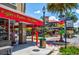 Street view of local stores, including Piglet's Pantry and dog bakery at 100 S Tremain St # G1, Mount Dora, FL 32757