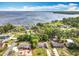 Stunning aerial view of lakefront homes, showcasing lush greenery and serene water views at 1108 Cedar St, Leesburg, FL 34748