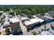 An aerial view captures a commercial area with buildings and streets at 1108 Cedar St, Leesburg, FL 34748