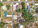 Aerial view of a residential neighborhood featuring well-maintained homes and landscaped yards at 1108 Cedar St, Leesburg, FL 34748