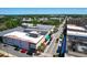 An aerial view captures a commercial area with buildings and streets at 1108 Cedar St, Leesburg, FL 34748