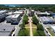 An aerial view showcases downtown with its charming streets, buildings, and a glimpse of the serene lake at 1108 Cedar St, Leesburg, FL 34748