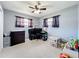 Cozy bedroom with carpet flooring, neutral walls and a ceiling fan at 1108 Cedar St, Leesburg, FL 34748