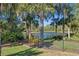 View of the large lake from the backyard that is fenced in black aluminum at 114 Cherry Creek Cir, Winter Springs, FL 32708