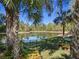 Enjoy a private backyard view of the lake with black aluminum fencing at 114 Cherry Creek Cir, Winter Springs, FL 32708