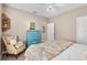 Inviting bedroom featuring neutral walls, bright accent chair, and matching paisley bedding at 114 Cherry Creek Cir, Winter Springs, FL 32708