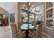 Bright dining area featuring a round glass table and views of outdoor living space at 114 Cherry Creek Cir, Winter Springs, FL 32708