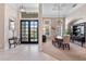 Elegant dining room with high ceilings, chandelier, and large windows offering natural light at 114 Cherry Creek Cir, Winter Springs, FL 32708