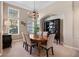 A dining room featuring a wooden table with six chairs under a chandelier, next to a dark wood china cabinet at 114 Cherry Creek Cir, Winter Springs, FL 32708