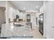 Bright kitchen featuring white cabinets, stainless steel appliances, and marble countertops at 114 Cherry Creek Cir, Winter Springs, FL 32708