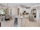 Open kitchen view with white cabinets, stainless appliances, and a center island with counter seating at 114 Cherry Creek Cir, Winter Springs, FL 32708