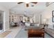 Open living room with view of the kitchen and breakfast nook, features modern furnishings at 114 Cherry Creek Cir, Winter Springs, FL 32708