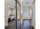 Bright main bathroom with dark wood floors and separate tub and vanity areas at 114 Cherry Creek Cir, Winter Springs, FL 32708