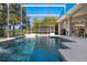 A backyard pool and hot tub with a screen enclosure, providing a relaxing and private outdoor space at 114 Cherry Creek Cir, Winter Springs, FL 32708