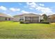 Expansive backyard featuring a well-maintained lawn, perfect for outdoor enjoyment at 1197 Eureka Mill Run, The Villages, FL 32162