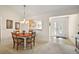 Cozy dining area adjacent to an open kitchen and the bright, inviting front entrance at 1197 Eureka Mill Run, The Villages, FL 32162