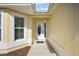 Welcoming front entrance features a decorative glass door and a charming anchor doormat at 1197 Eureka Mill Run, The Villages, FL 32162