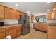 Modern kitchen features stainless steel appliances and overlooks the living area and dining space at 1197 Eureka Mill Run, The Villages, FL 32162