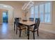 Bright dining area with large windows, shutter blinds, and modern lighting fixture at 1239 Russell Loop, The Villages, FL 32162