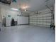 Clean and spacious garage featuring ample storage cabinets and organization solutions at 1239 Russell Loop, The Villages, FL 32162