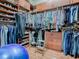 Well-organized walk-in closet with custom shelving and hanging racks, maximizing storage space at 1239 Russell Loop, The Villages, FL 32162