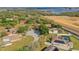 Aerial shot captures a lakeside residential neighborhood, showcasing a street leading to homes near ongoing construction at 12620 Bay Breeze Ct, Clermont, FL 34711