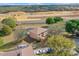 A spacious home with an enclosed pool and large yard is visible in this overhead shot with construction nearby at 12620 Bay Breeze Ct, Clermont, FL 34711