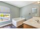 Bathroom featuring a soaking tub, window, and a single sink vanity at 12620 Bay Breeze Ct, Clermont, FL 34711