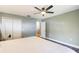 Bedroom with a ceiling fan and a large closet at 12620 Bay Breeze Ct, Clermont, FL 34711