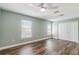 Bright bedroom with wood floors, natural light, and a closet at 12620 Bay Breeze Ct, Clermont, FL 34711